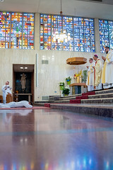Luke Daghir prostrates while the liturgy of supplication is sung.