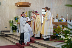 Bishop Persico prays the prayer of ordination over Luke Daghir.