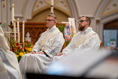 Deacon Cory Pius and Deacon Chris Beran listen attentively to Bishop Persico's homily.