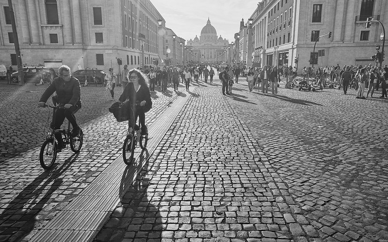 a couple cycling away from the vatican<br/>© <a href="https://flickr.com/people/23808252@N00" target="_blank" rel="nofollow">23808252@N00</a> (<a href="https://flickr.com/photo.gne?id=52968901528" target="_blank" rel="nofollow">Flickr</a>)