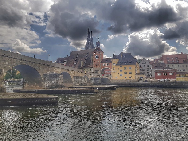 Learning about history near an old bridge in Regensburg as the clouds play their game<br/>© <a href="https://flickr.com/people/194498740@N02" target="_blank" rel="nofollow">194498740@N02</a> (<a href="https://flickr.com/photo.gne?id=52972688068" target="_blank" rel="nofollow">Flickr</a>)
