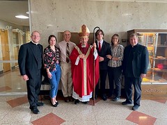 Seminarian Joe Preston and family pose with Bishop Persico, Fr. Jason Feigh, and Fr. Brian Vossler on St. Mark Day.