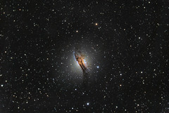 NGC 5128 or Centaurus A is one of the closest radio galaxies to Earth at a distance of 11 million light years.
