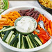 Healthy food in a restaurant - white creamy dip and raw vegetable variations