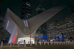 Silhouette of couple in front of the Oculus at night in Lower Manhattan