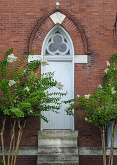 Church exterior / door / brick / crape myrtle
