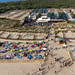 Aerial view of touristy area on a sandy beach with sun umbrellas in Portugal, Europe