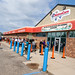 Customers wait in a long line to get into NativeCare on the Red Lake Reservation in Minnesota