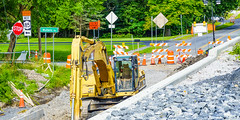 Signs and a trackhoe