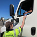 Amber Vianos of Ashland Enforcement gives water to a truck driver