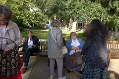 Catherine Cooke checks her bag, and Elaine McCafferty converses with Rakshita Patel (photo by Roger Johnson)