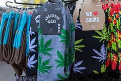 Amsterdam socks with hemp leaf design in different colors in a souvenir shop in Amsterdam, Netherlands