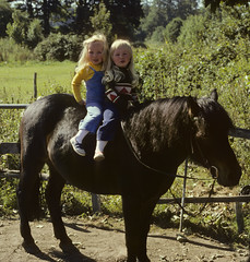 Twins' first poney ride