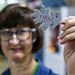 Researcher posing with 3D printed logo