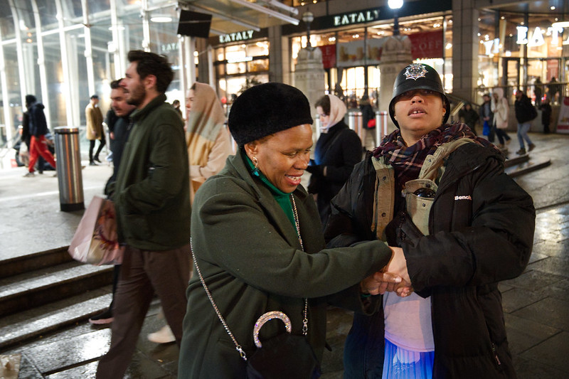 DSC_4219 Alesha Jamaican Model in Black Coat and Police Hat with Ditshupo aka Dee Beautiful Nurse from Botswana in Green Coat with Black French Beret Hat on Locarion Liverpool Street Railway Station Bishopsgate City of London<br/>© <a href="https://flickr.com/people/41087279@N00" target="_blank" rel="nofollow">41087279@N00</a> (<a href="https://flickr.com/photo.gne?id=53485283592" target="_blank" rel="nofollow">Flickr</a>)
