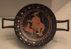 Apulian Red Figure kylix representing Hermes seated with a hound