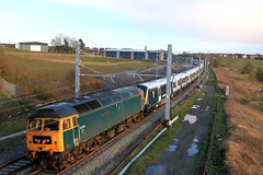 GBRf Class 47 No 47727 drags SWR unit No 701012 passes a much changed Kibworth Beauchamp scene from Wistow Road Bridge, MML on 1.3.24 with 5Q24 1155 Eastleigh Trsmd to Derby Litchurch Lane move in low weak sun