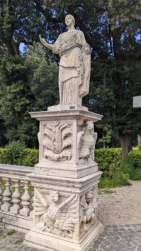 Stone statue on wall outside Casino Nobile di Villa Borghese Museum in Villa Borghese Park in Rome, Italy