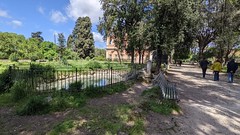 Pond and main path in the grounds of Villa Celimontana in Rome, Italy