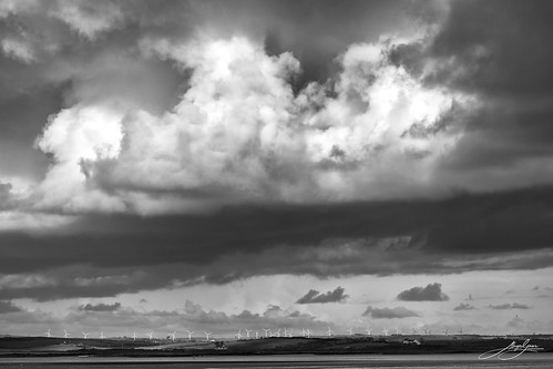 Dramatic skies over Llyn Alaw wind farm, Ynys Môn, North Wales.
