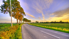 All roads must bend. Kanaalweg, village of Warmenhuizen, The Netherlands.