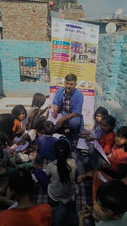 Blue Pen’s Volunteer Shiv sagar teaching  basic English to 1st and 2nd grade students in Munirka slum today, 7th April’24.