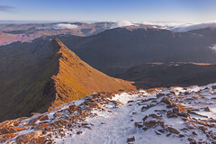 Snow on the summit of Helvellyn and Striding Edge leading away to the east