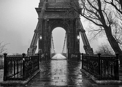 A foggy Bridge Base , South Portland Street Suspension Bridge, River Clyde, Glasgow, Scotland, UK B&W