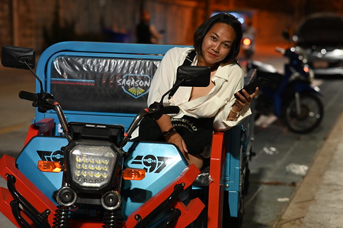DSC_1564: a woman is sitting on a small motorcycle