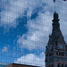 Milwaukee City Hall reflected on glass building