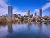 Tokyo's High-Rise Skyline Reflects in Shinobazu Pond