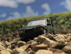 Land Rover driving over stones.