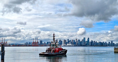 tugboat and view of downtown vancouver