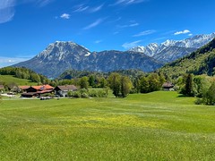 Snow-covered Wilder and Zahmer Kaiser mountain ranges on a beautiful spring day seen from Rechenau near Kiefersfelden in Bavaria, Germany