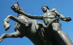 “A Horse with a Walking Youth” (1838) by sculptor Peter Clodt von Jürgensburg (Pyotr Klodt) - one of four Bronze sculptural groups “The Taming of a Horse by Man” on the Anichkov Bridge over the Fontanka River, Nevsky avenue, Saint-Petersburg, Russia.