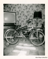 Bicycle with Training Wheels in the Living Room