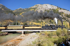 A Durango & Silverton Narrow-Gauge Scenic Railroad train, pulled by a vintage steam locomotive, crosses an alpine bridge in San Juan County, Colorado (LOC)