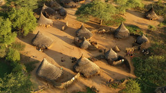 Aerial view of a Larim tribe village with Thatched roofs houses, Boya Mountains, Imatong, South Sudan