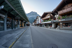 Grindelwald, Switzerland - July 24, 2024: The empty streets of the Swiss Alps village of Grindelwald, early in the morning. Fisheye view