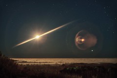 After the auroras danced in the north, I turned to catch the moonrise over a foggy ocean