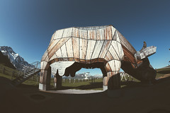 Mannlichen, Switzerland - July 24, 2024: Huge alpine playground featuring a giant cow slide in the Swiss alps