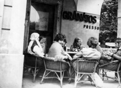 People socializing at Gránátos café terrace in 1970s Fertőd, Hungary