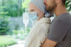 Hugging wife with malignant cancer