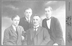 Vintage family portrait of a father and three sons, Orsova, Hungary, early 1900s.