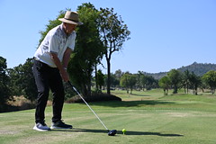 DSC_7037: a man in a hat playing a game of golf