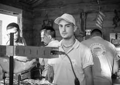 Guys operating a fast food stand