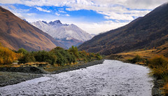 The Snostskali river flowing beneath the watchful gaze of North Chaukhi