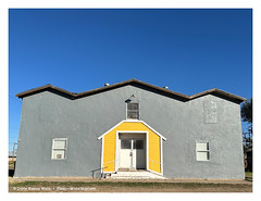 Inscrutable Building, Yellow and Gray, Under a Sky that’s Doing Its Part in Case Anyone Decides to Take a Photo