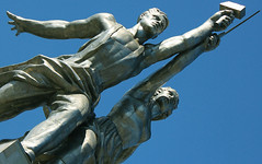 Worker and Kolkhoz Woman (Рабочий и колхозница) by avtor Vera Mukhina since 1937. Height of Sculpture with pedestal 60 meters. Two figures with a sickle and a hammer raised over their heads. Russia, Moscow, Mira avenue, Ostankinsky District.