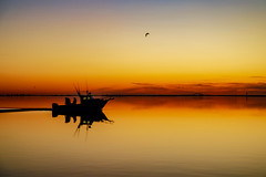 Sunrise with Silhouetted Boat